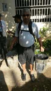 Richard from Emmanuel Intl collecting water